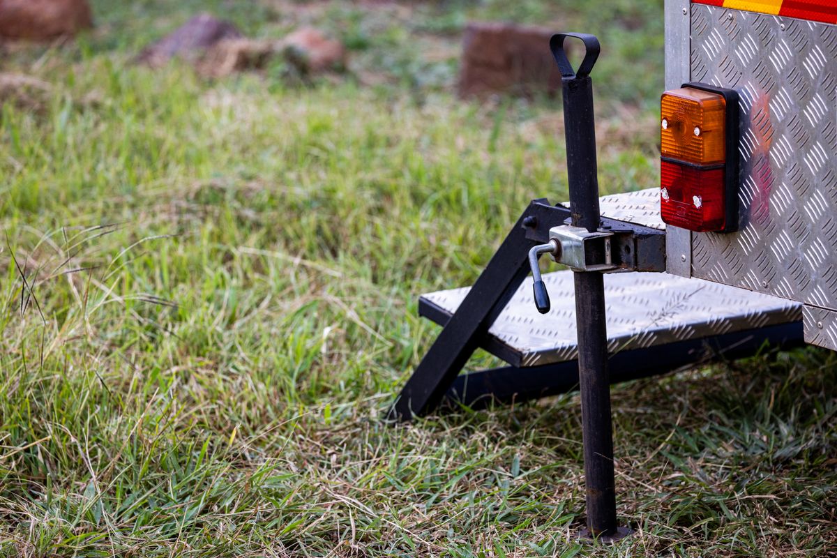 Close-up of a utility trailer support and rear light